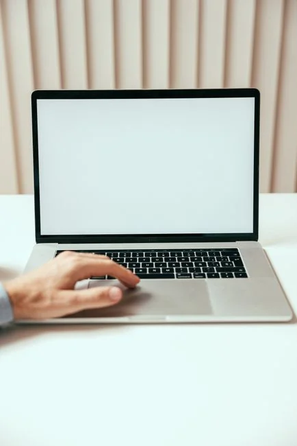 A modern computer screen displaying web design work, showcasing creative visuals in a workspace.